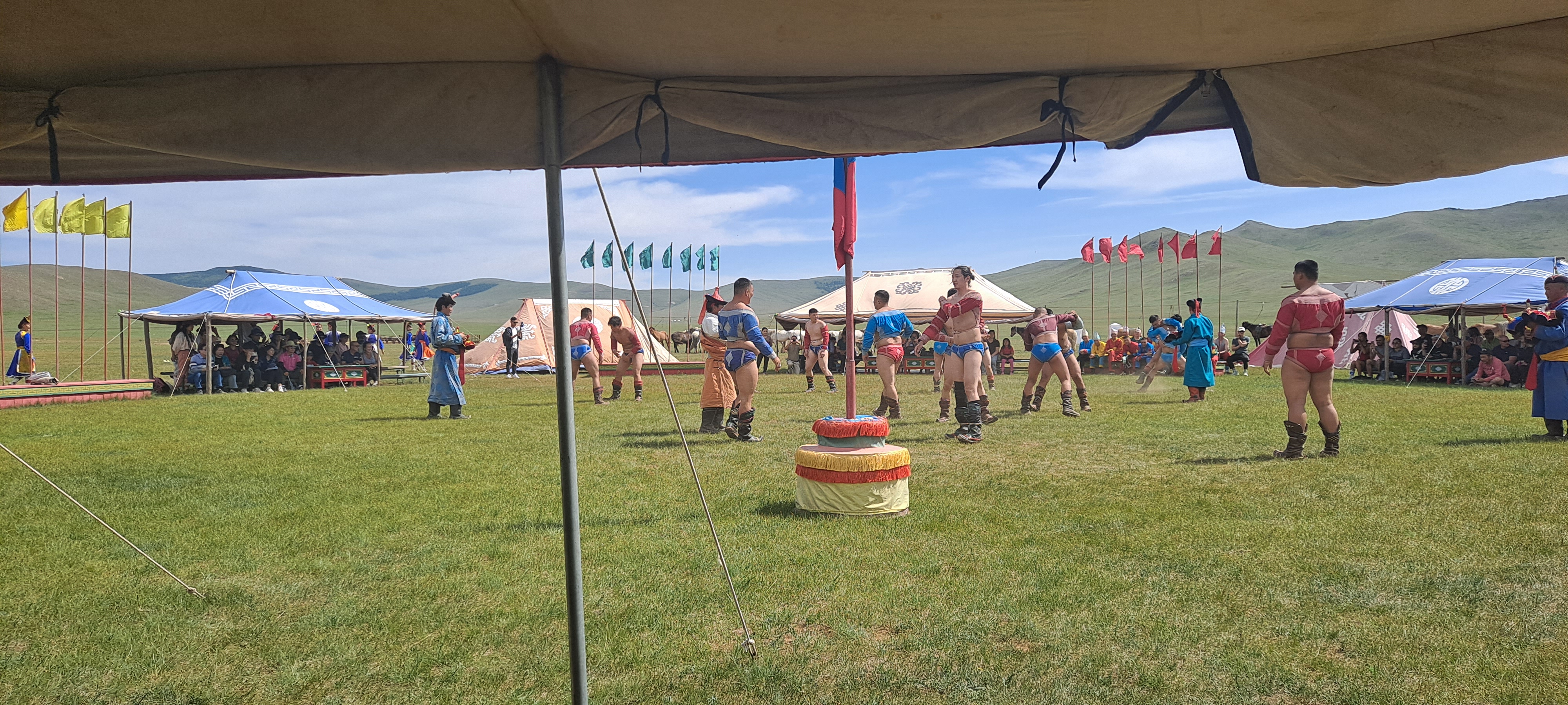 Mongolian wrestlers in traditional Naadam competition