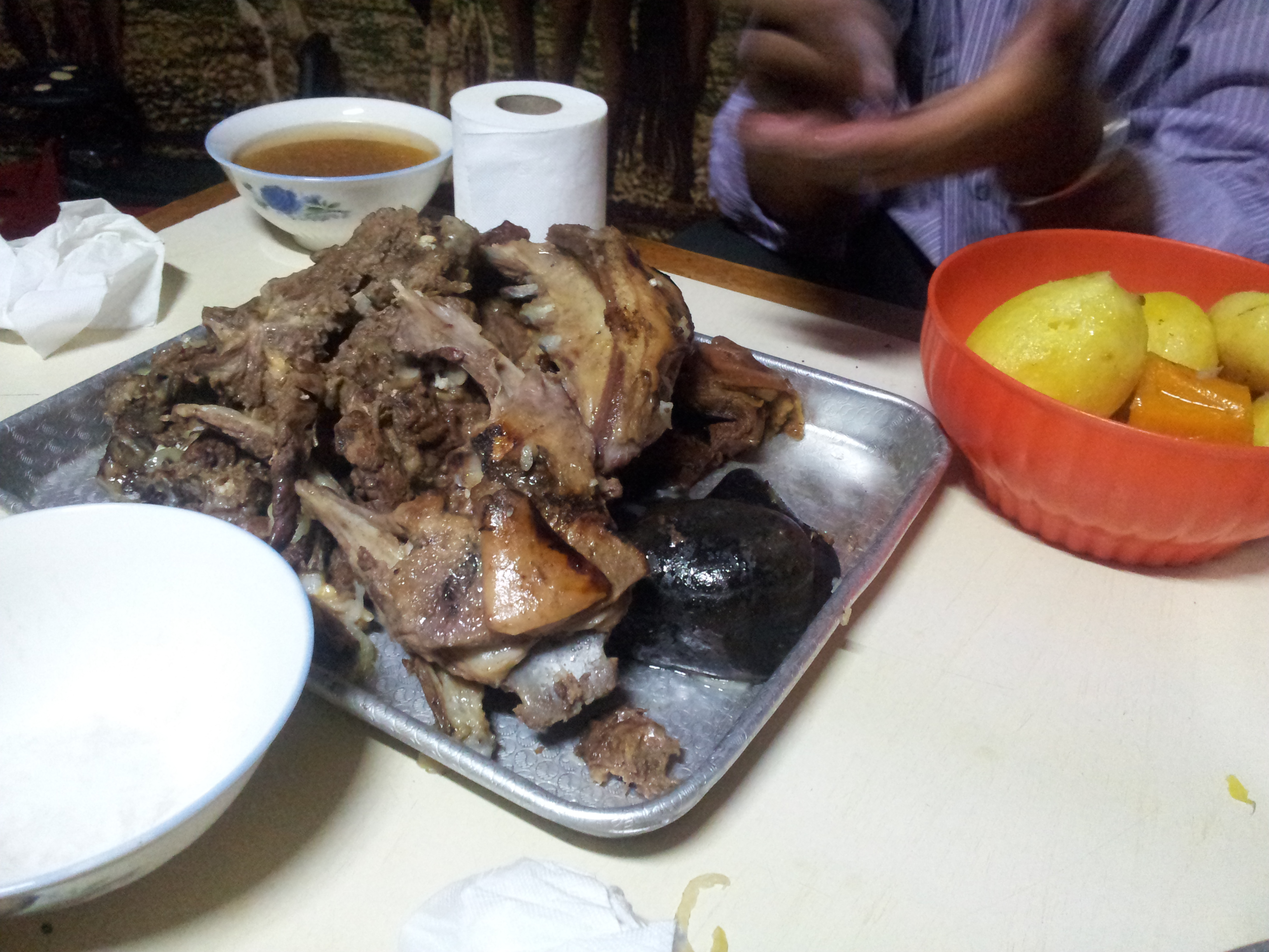 Traditional Mongolian cooking over an open fire in the ger